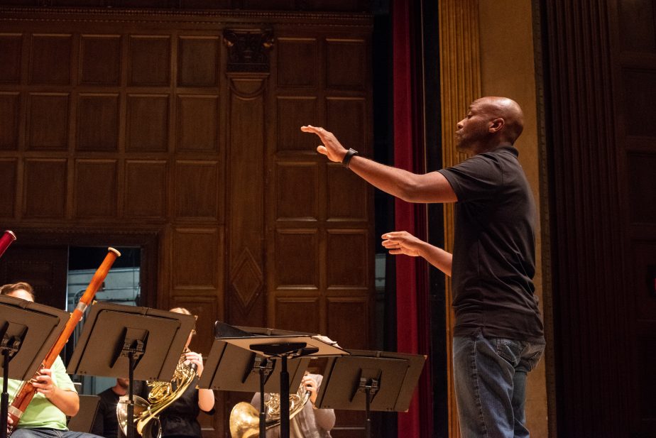 Conductor leading small ensemble