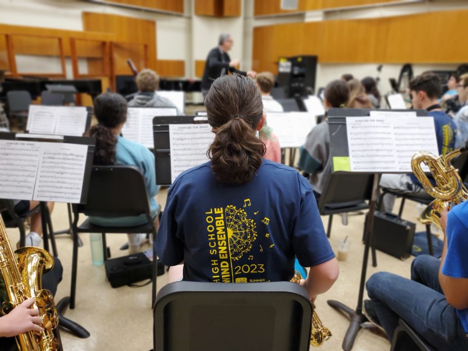 Back of student playing in ensemble setting